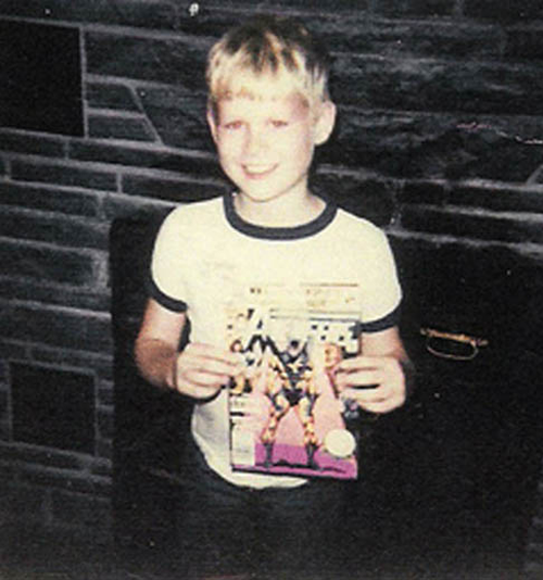 Young boy holding a comic book